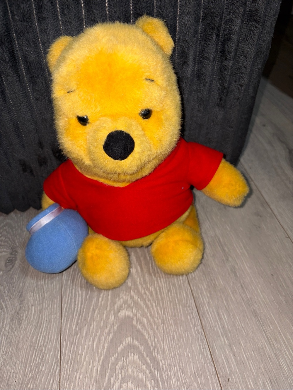 Soft Yellow Plush Bear with Red Shirt and Blue Accessory - Cozy Cuddly Toy